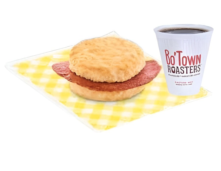 Bojangles country ham biscuit combo with coffee on a wooden table