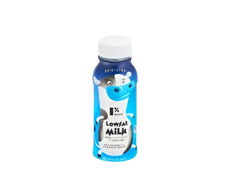 A tall glass of fresh low-fat milk on a table